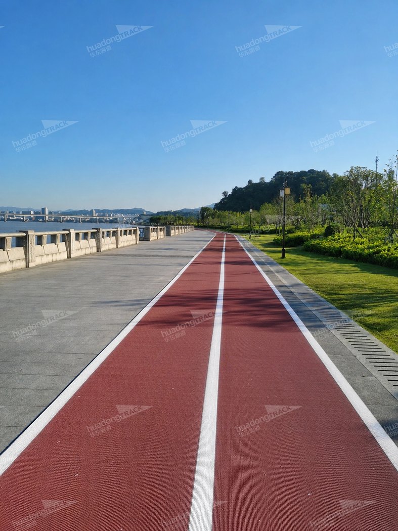 Red recreational running lanes along the riverside in Lucheng
