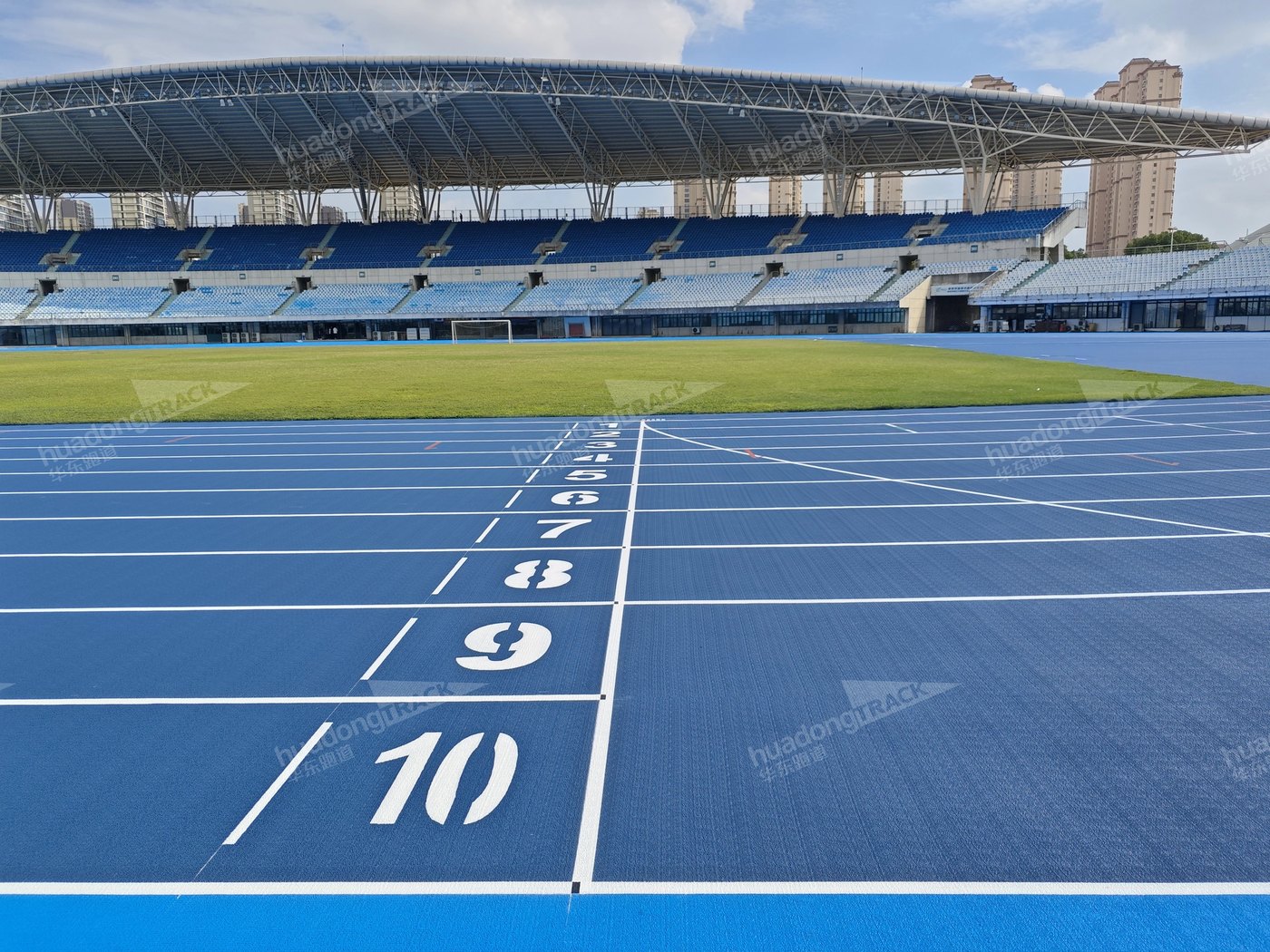Blue starting lanes and white lane numbers at Changshu Sports Center