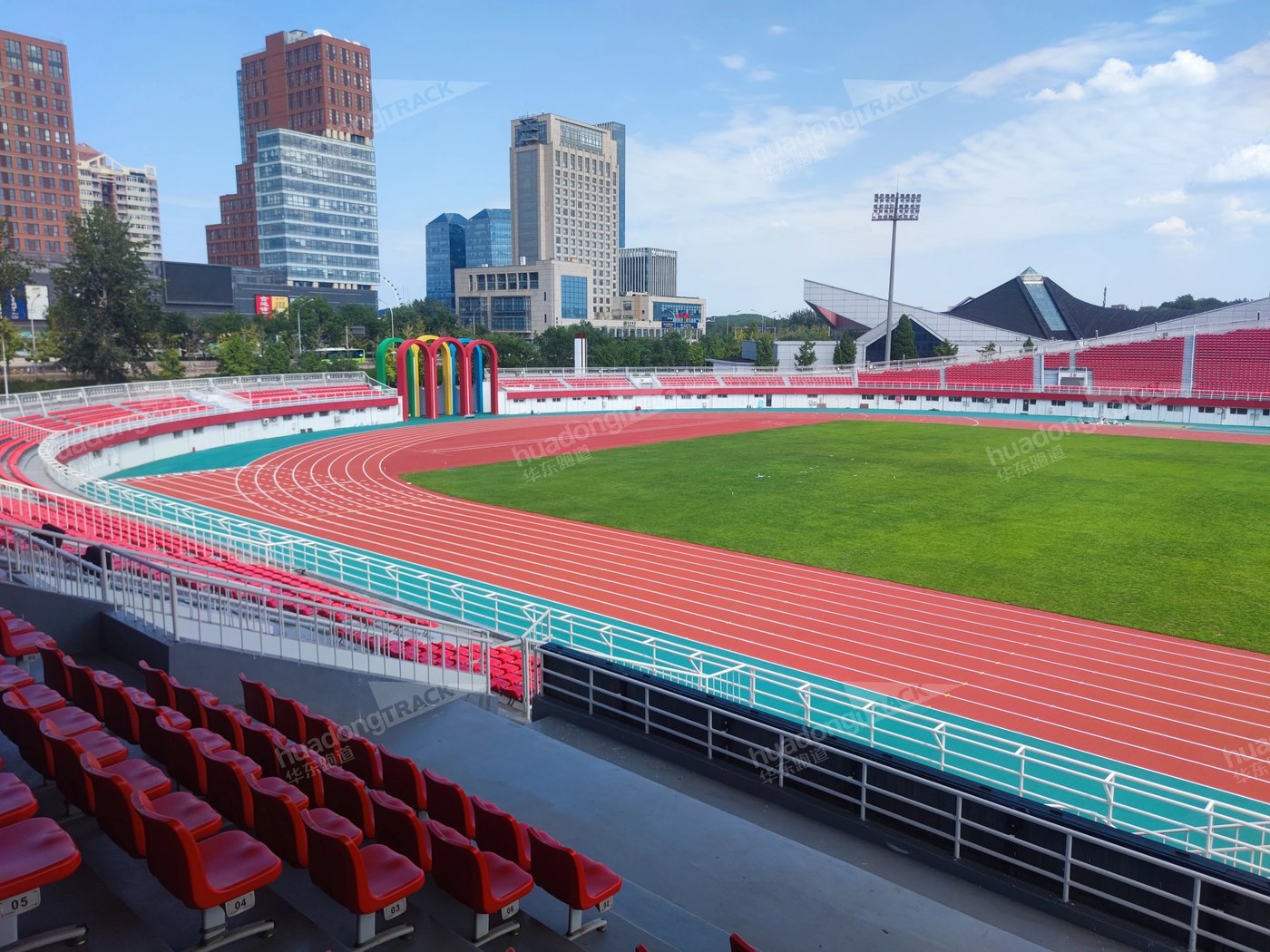 Curved running lanes and spectator seating at Shijingshan Stadium